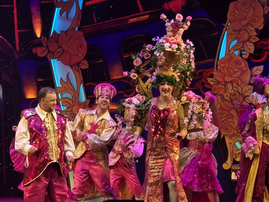 Justin Fletcher (left) and Paul Morse (wearing an elaborate headgear) during the finale dance of Beauty and the Beast