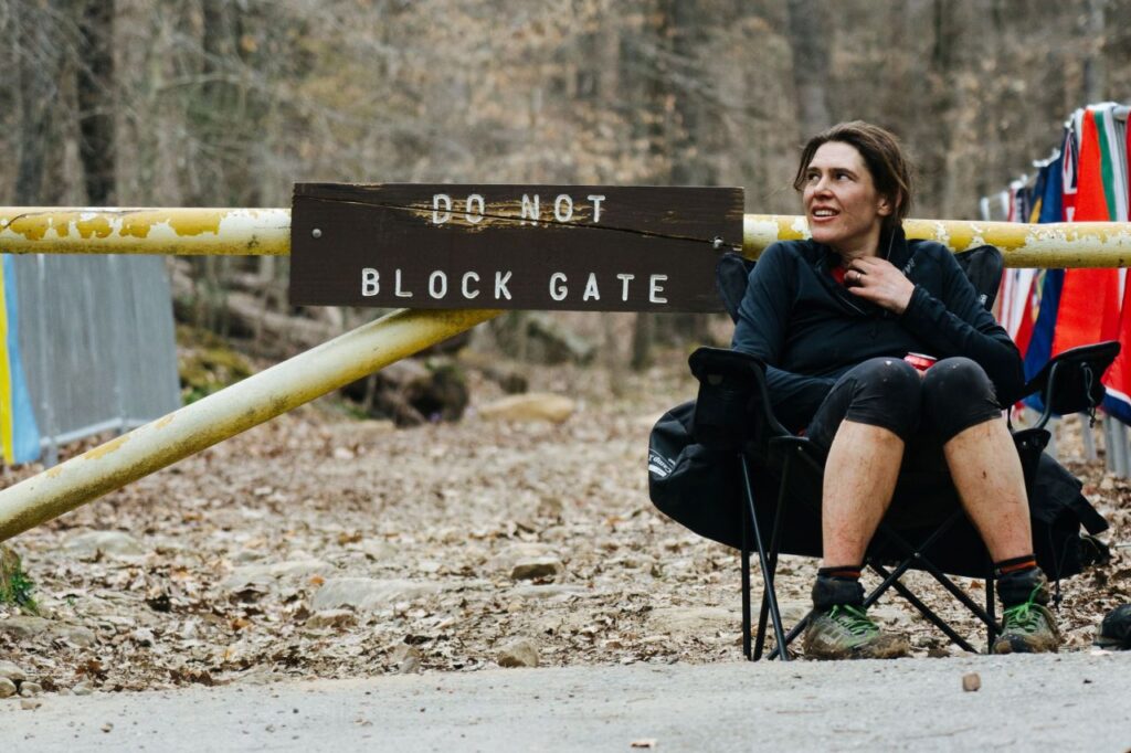 Person sitting near a blocked gate from The Finisher, one of the films in the Banff Mountain Film Festival 2026