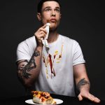 Ed Gamble with a hot dog