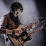 Greg Webb from The Illegal Eagles on a two-headed guitar