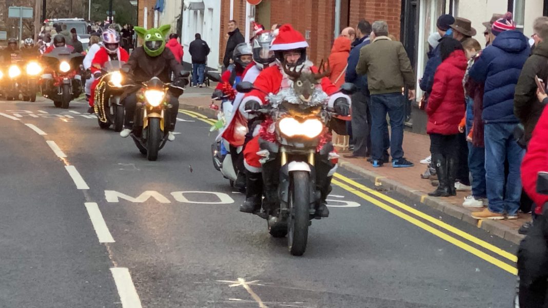 Bikers riding through the streets of Wokingahm