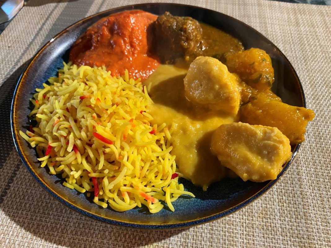 A selection of main courses from The Taste of Tandoori's Sunday buffet: pilau rice, Chicken Tikka Massala, Lamb Curry, and Chicken Korma