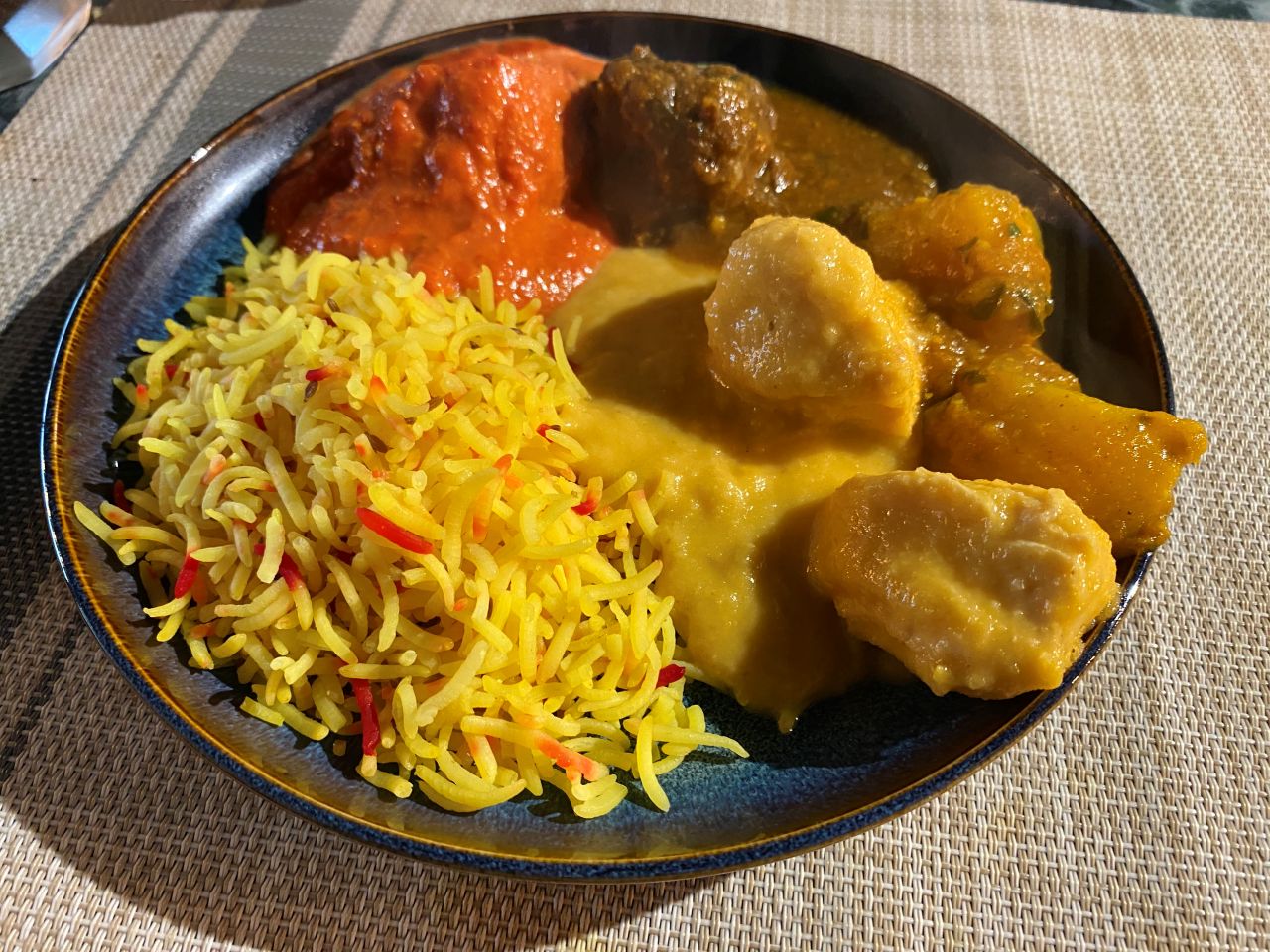 A selection of main courses from The Taste of Tandoori's Sunday buffet: pilau rice, Chicken Tikka Massala, Lamb Curry, and Chicken Korma