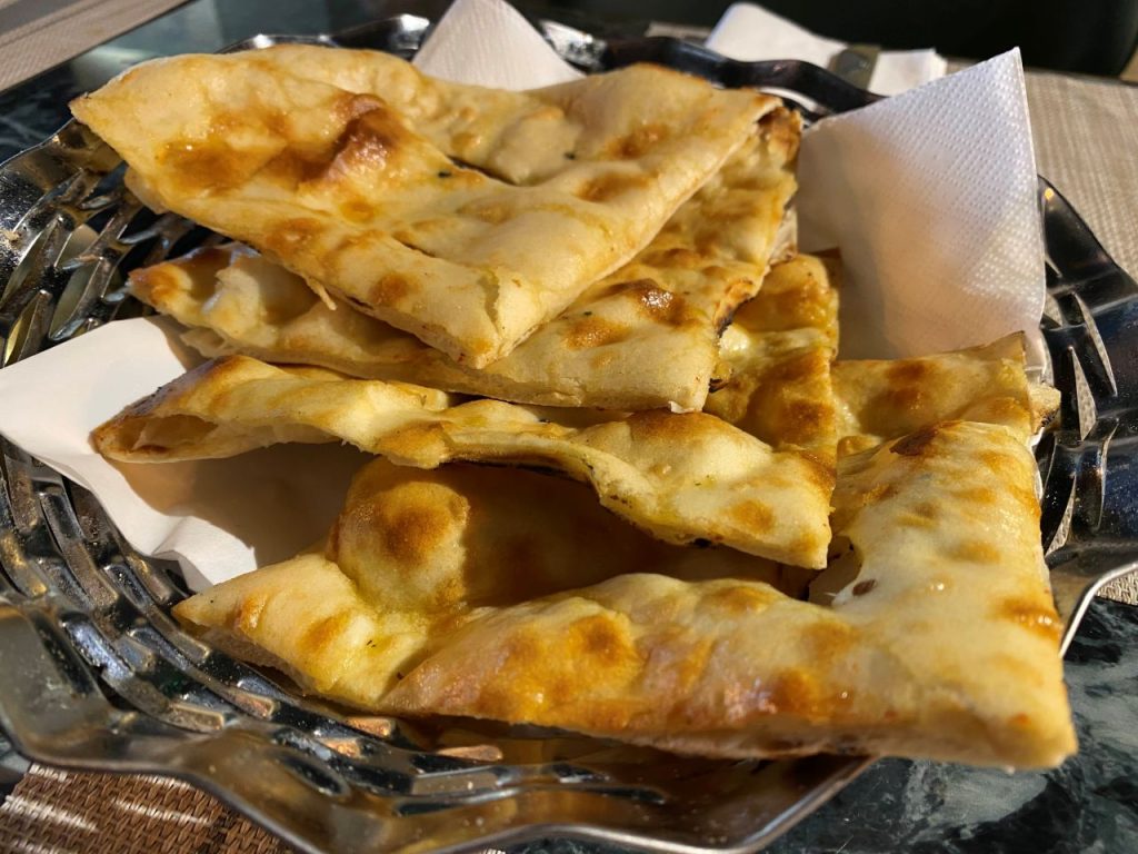 Naan bread at The Taste of Tandoori in its basket