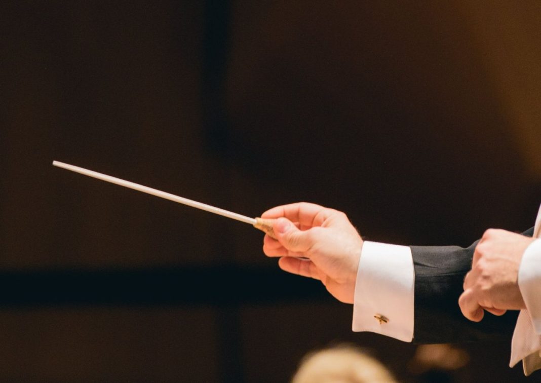 A conductor with a baton