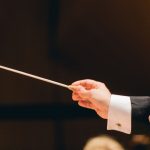 A conductor with a baton