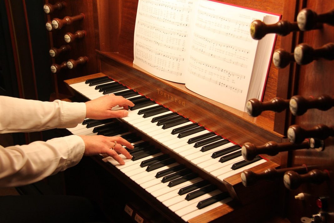 An organist playing the instrument