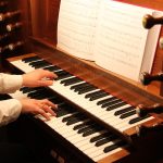 An organist playing the instrument