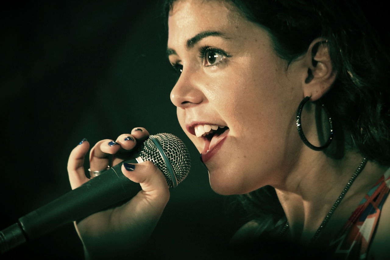 A woman singing into a microphone