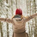 A woman with her back to us in the snow