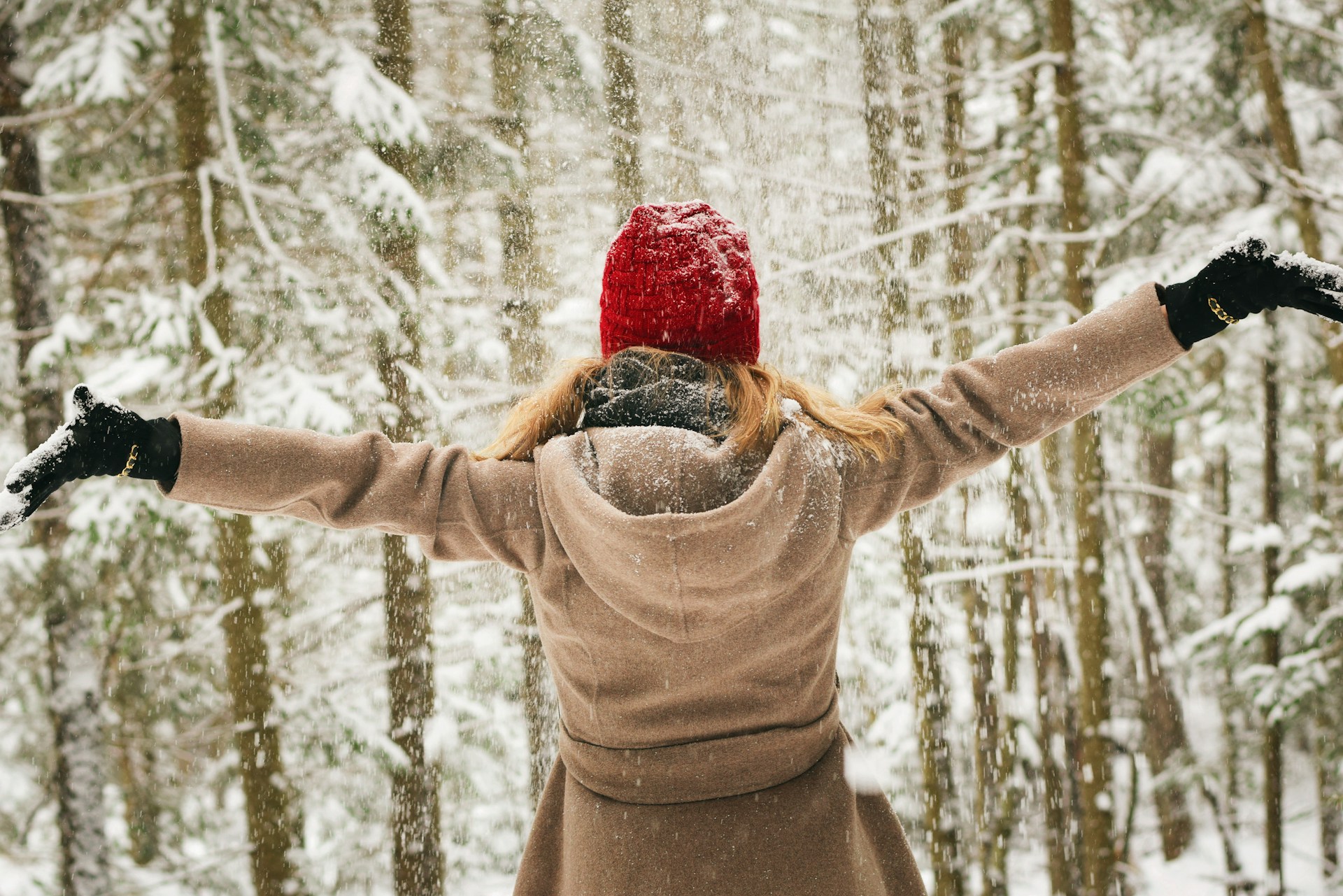 A woman with her back to us in the snow