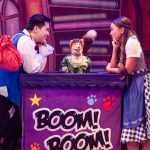 Basil Brush (centre) with Mikko Juan (left) and Mia Welsh (right). The two actors are leaning on their elbows looking in