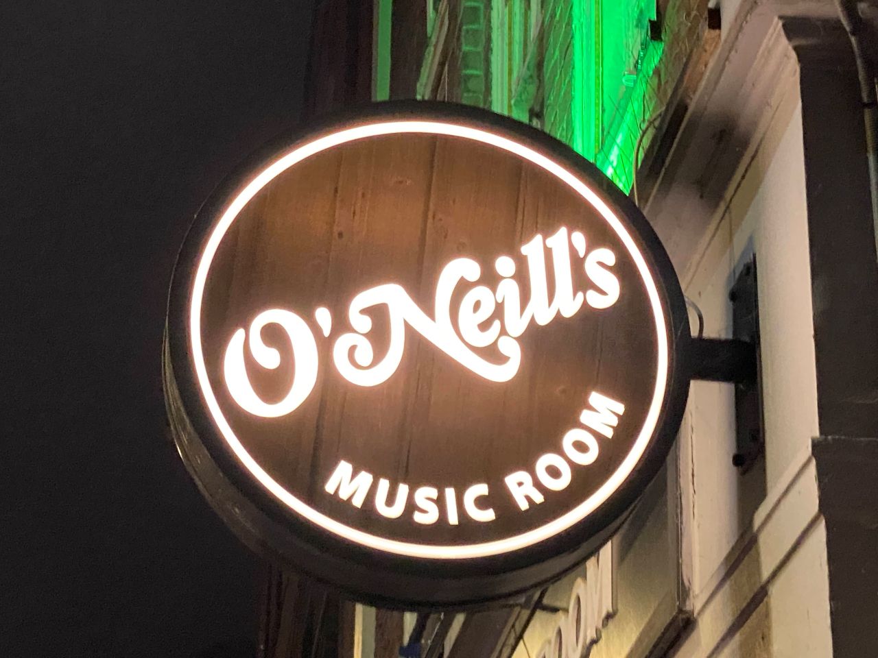 O'Neills Music Room sign lit up at night