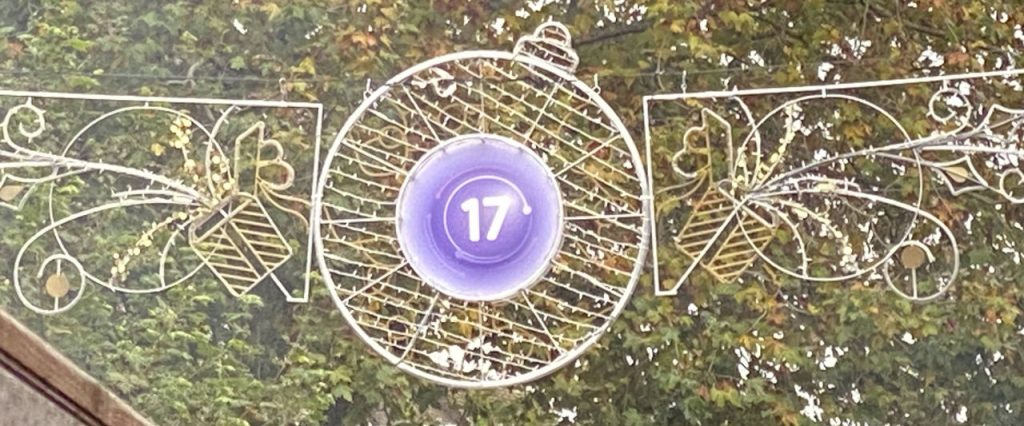 A Christmas light with the logo of the Purple 17 bus route 