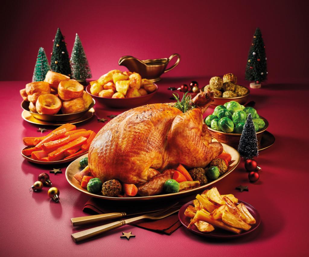 a table full of Christmas food centred around a turkey, using ingredients from Aldi