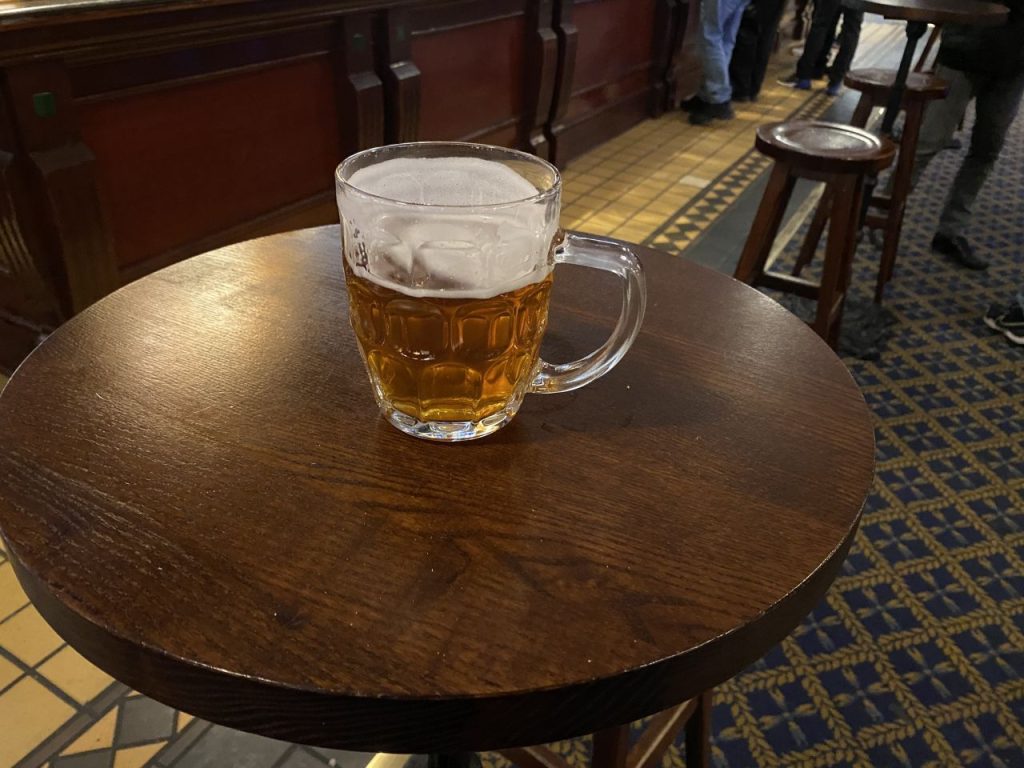 a glass of beer on a table