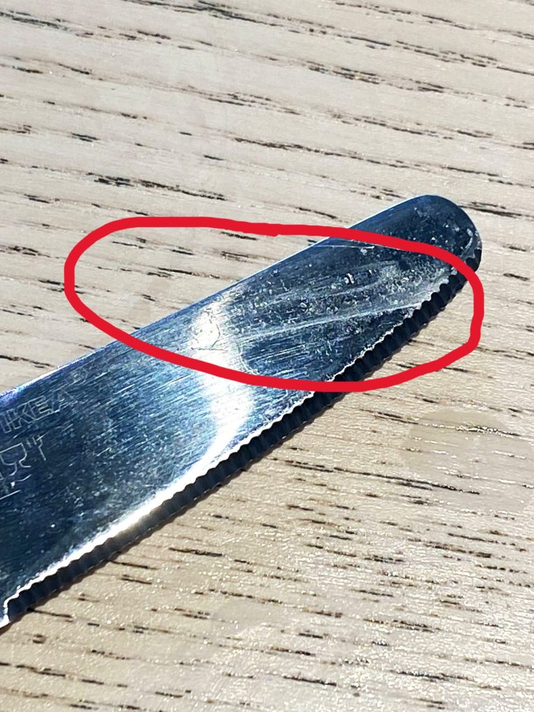 A knife from IKEA's kitchen ... the residue from a previous meal is in the area marked by a red circle