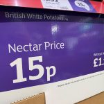 a purple box with white text and numbers on it showing the price of a 2kg bag of potatoes at Sainsbury's - for Christmas dinner