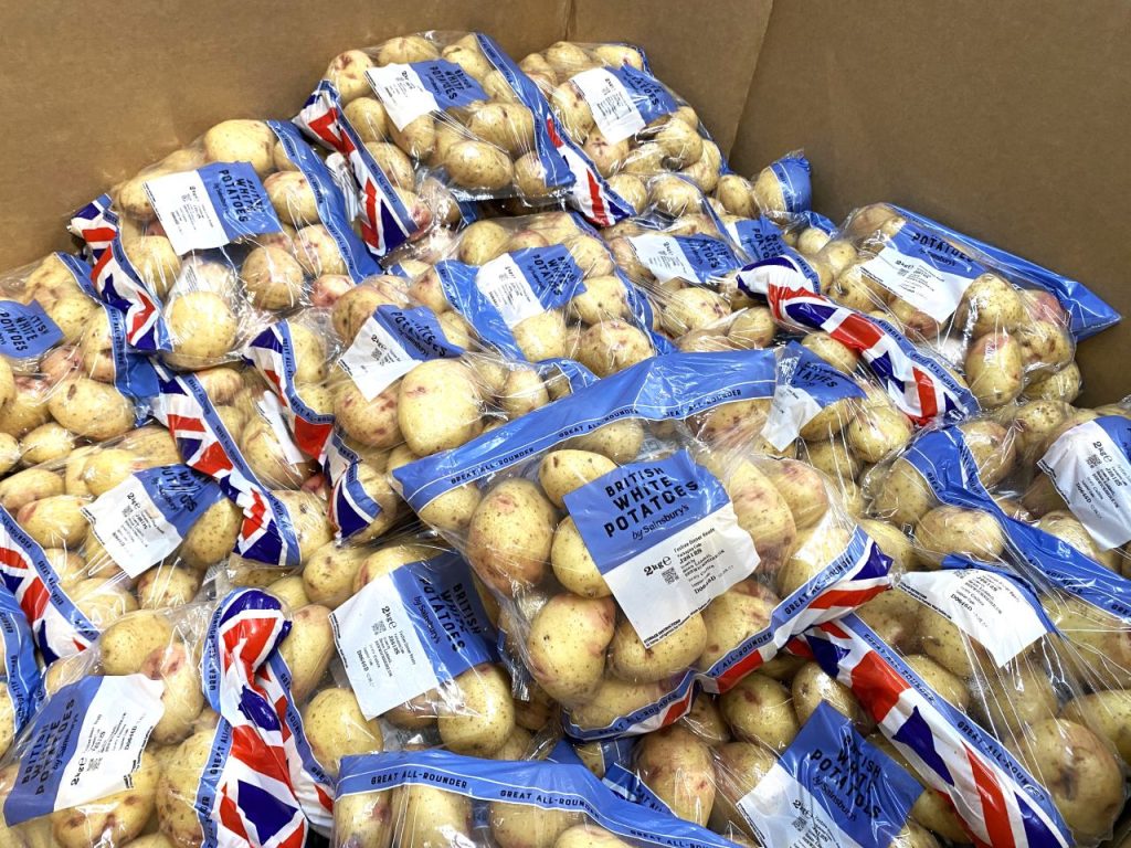 a box containing bags of potatoes fit for a Christmas dinner