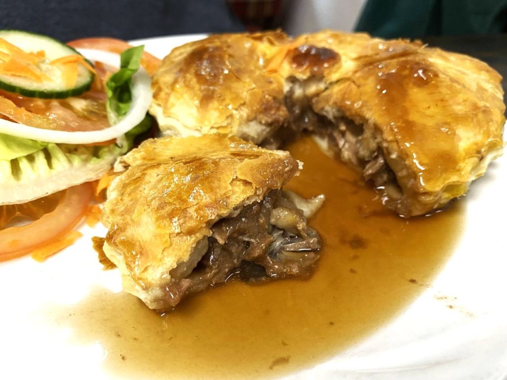 The Steak and Kidney pie at Sweeney with added gravy. Every pie comes with a small side salad