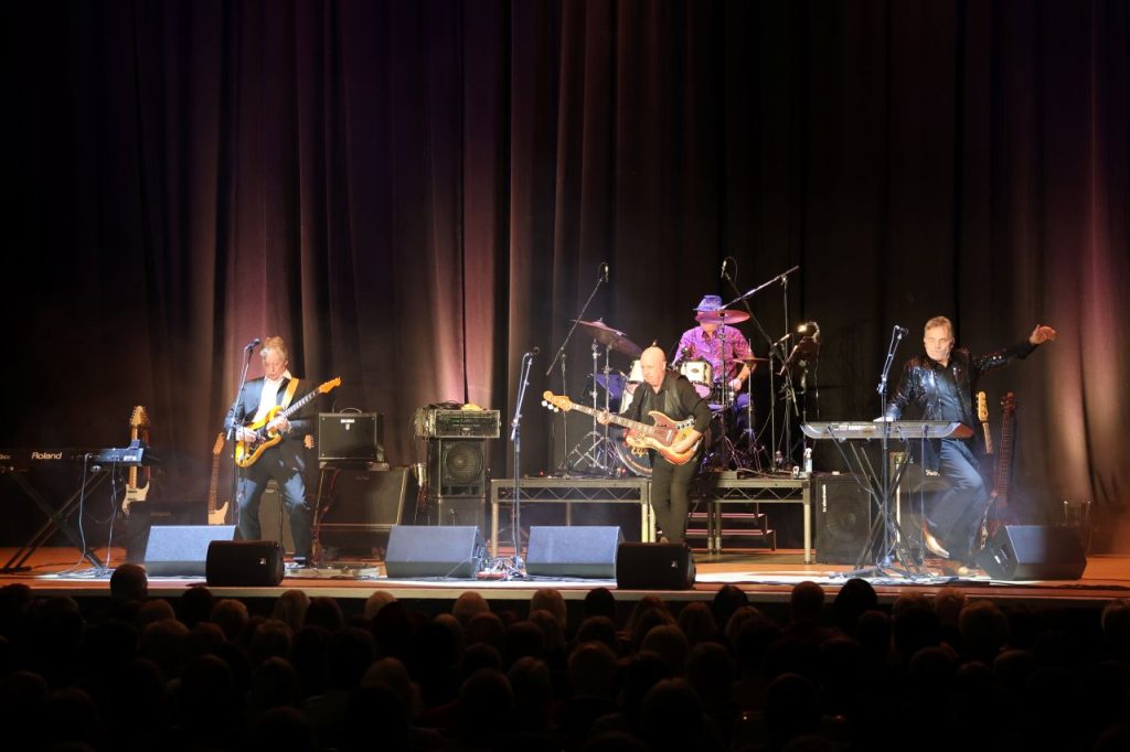 The Fortunes on a stage playing instruments