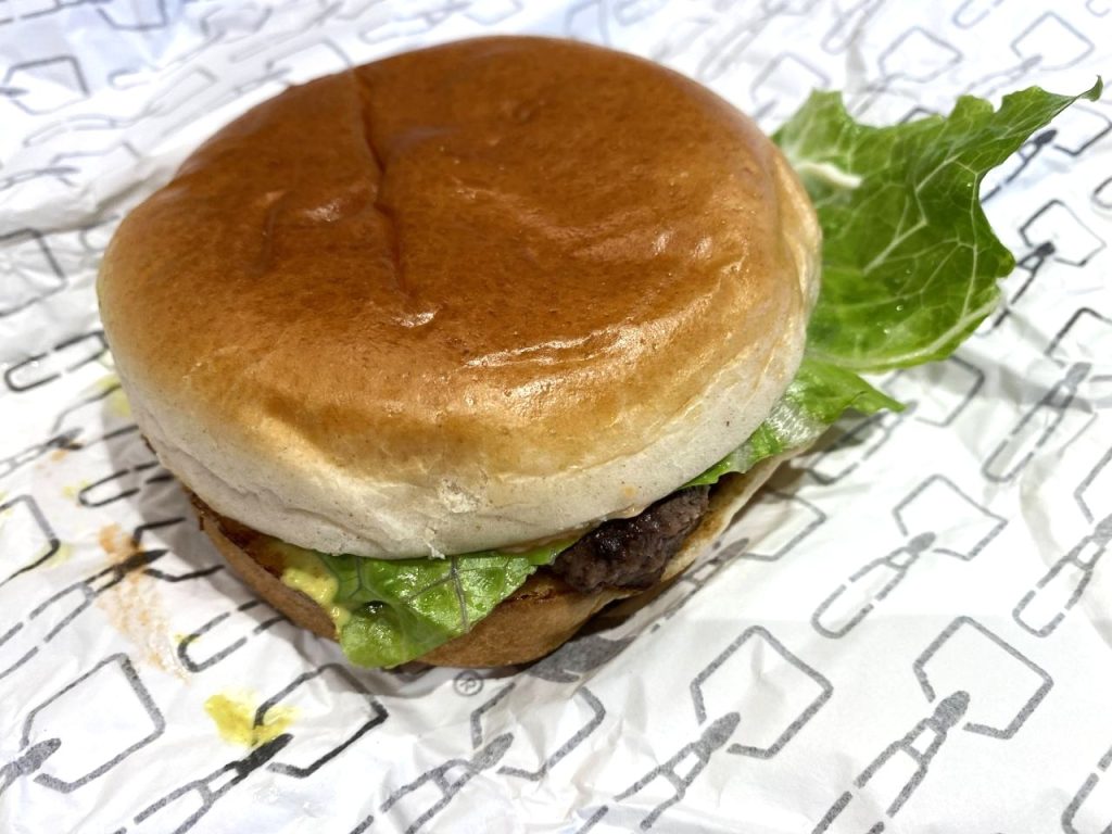 a hamburger on a paper wrapper from Wendy's