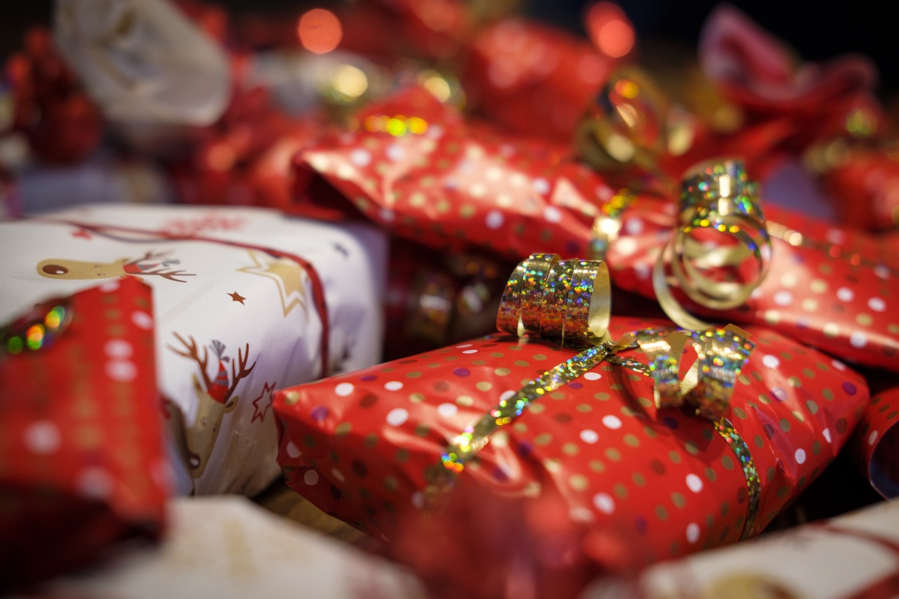 presents wrapped presents with ribbons to mark Woodley Concert Band's Christmas concert