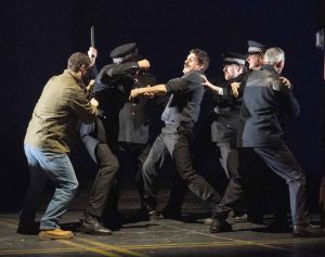 A fight scene. In the middle is Yosser Hughes, 'star' of Boys From The Blackstuff