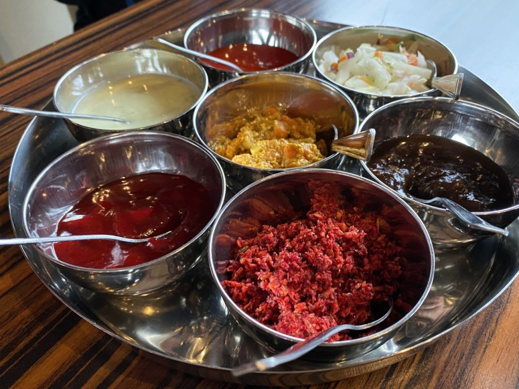 The immaculate pickle tray at Curry Chef offers unique takes on the popular condiments