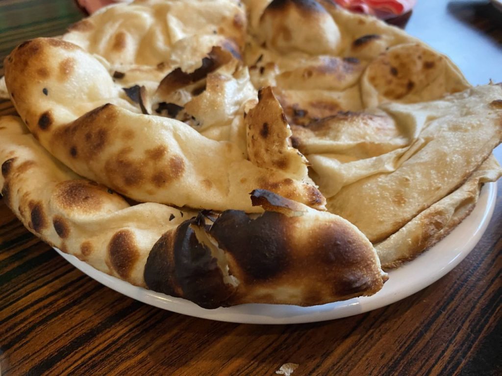 a plate of naan bread on a table