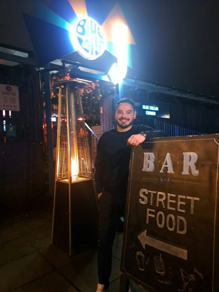 Glen Dinning outside the entrance to Blue Collar Corner