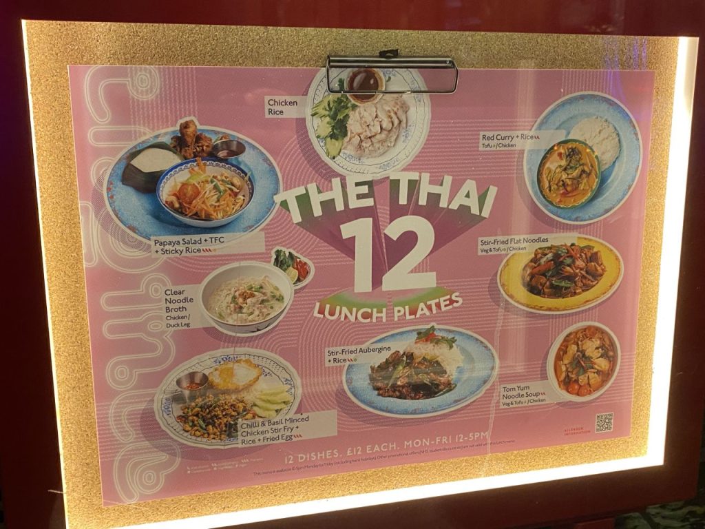 a menu board with pictures of food on it - Rosa's Thai