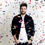 Joel Dommett with confetti coming down around him