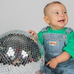 Wonder Gigs features music from under fours. It is illustrated with a discoball and a toddler