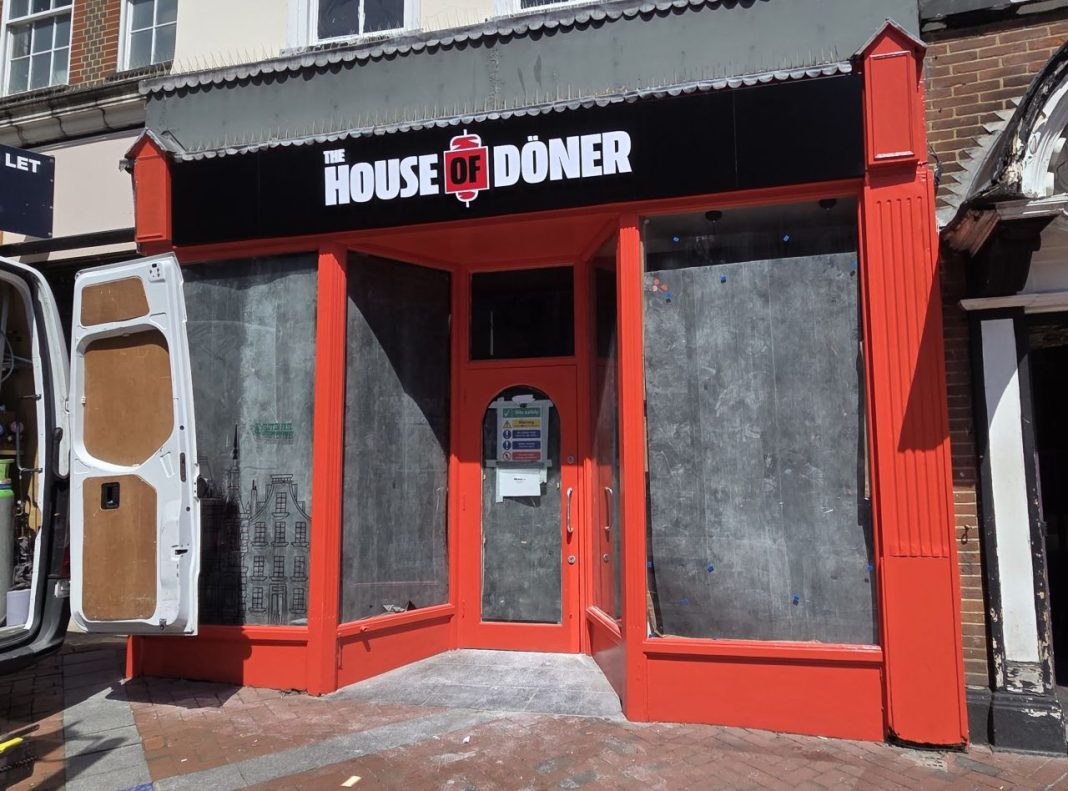 The front of the House of Doner store opening in Reading's Broad Street. The windows are covered over as work begins