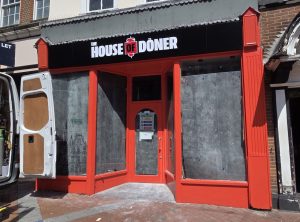 The front of the House of Doner store opening in Reading's Broad Street. The windows are covered over as work begins
