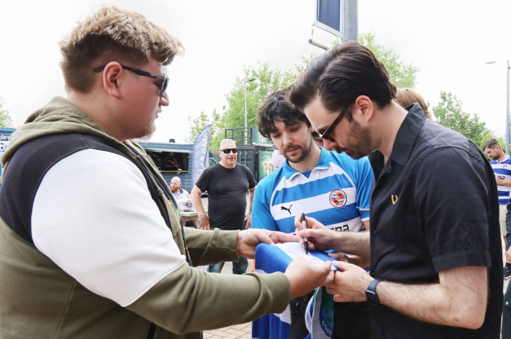 The Amazons sign autographs for their fans