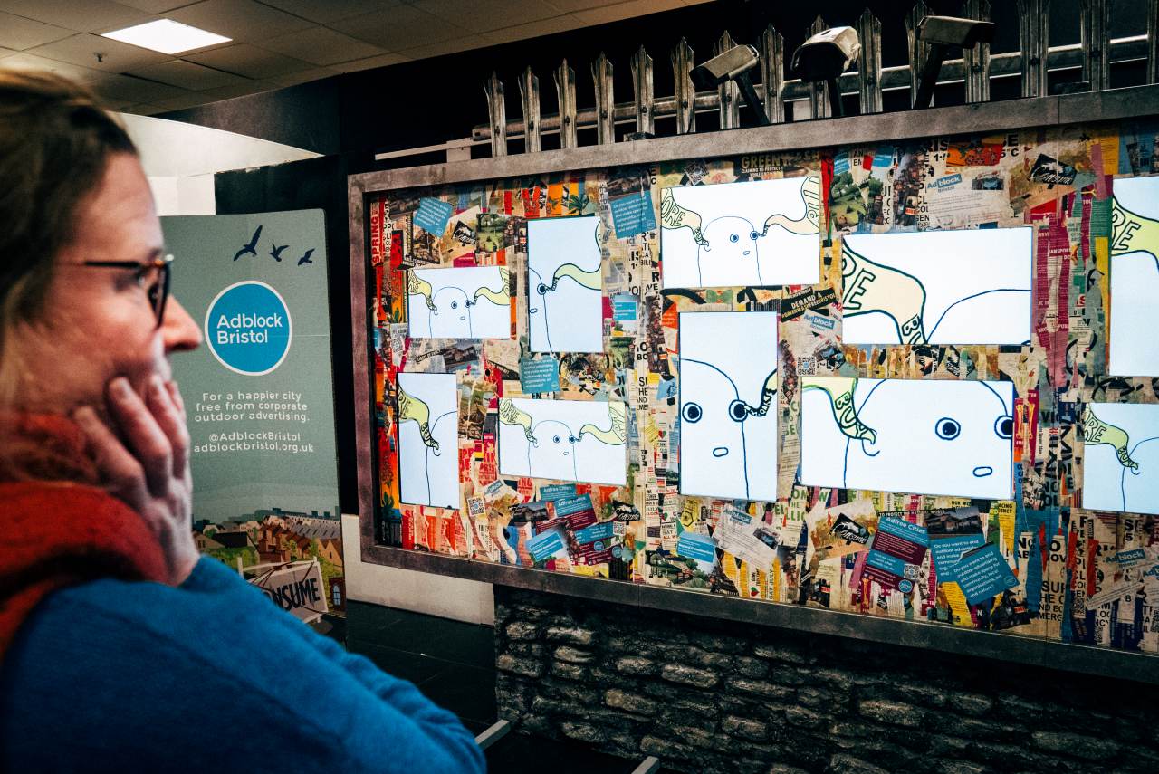 A person viewing the Digital Dystopia exhibition when it visited Bath