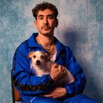 Aussie comedian Josh Glanc holding a dog