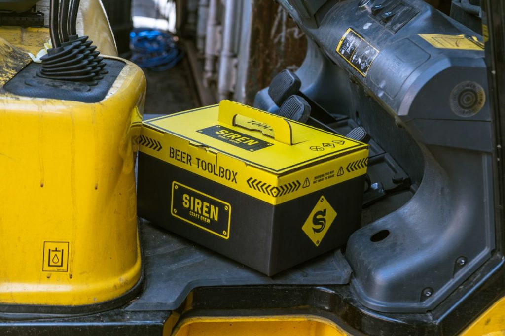 The Siren Craft Brew tool box gift set next to some tools