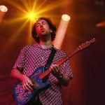 The Wombats wowed the crowds at Englefield Live - a man playing an electric guitar