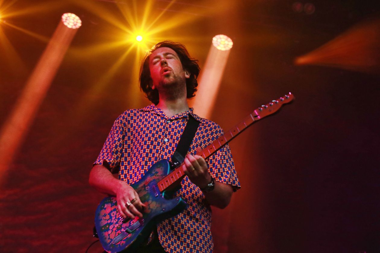 The Wombats wowed the crowds at Englefield Live - a man playing an electric guitar