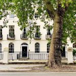 A Georgian street scene with a tree