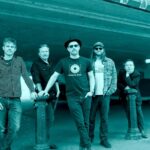 The Dreaming Spires band shot - it is a duotone image (like black and white, but tinted blue)