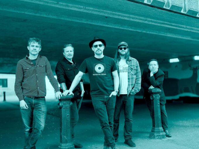 The Dreaming Spires band shot - it is a duotone image (like black and white, but tinted blue)