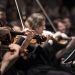 Violinists performing in a concert