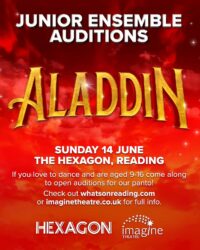 A promotional poster with a vibrant red and orange sky backdrop filled with clouds and a few sparkling stars. At the top, the words Junior Ensemble Auditions are written in bold white capital letters. Below this, the word Aladdin is displayed in large, three-dimensional golden text with a subtle metallic texture. The lower section of the poster contains white text stating Sunday 14 June, The Hexagon, Reading. Below the date and venue, a message reads If you love to dance and are aged 9-16 come along to open auditions for our panto! Check out whatsonreading.com or imaginetheatre.co.uk for full info. At the very bottom, the logos for Hexagon and Imagine Theatre are displayed side by side in white.