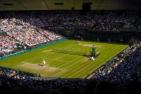 A game of tennis taking place at Wimbledon