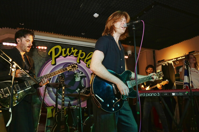 The Amazons performing on stage at The Purple Turtle, featuring Matt Thomson on lead vocals and guitar alongside guitarist Chris Alderton