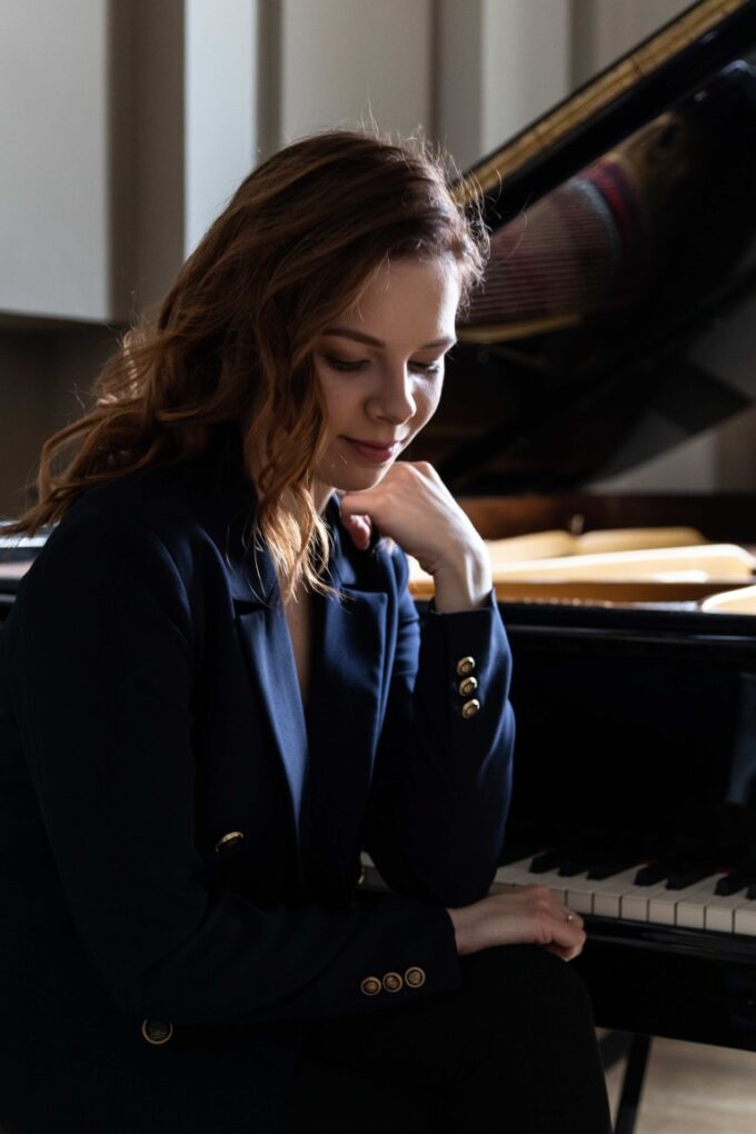 Classical pianist Gabrielé Sutkuté seated at a piano